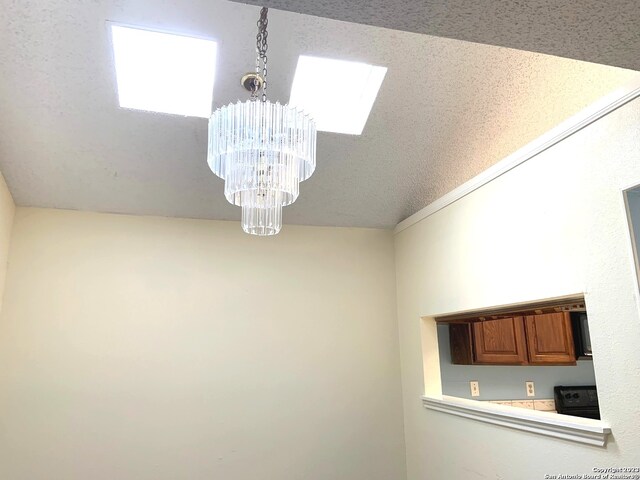 interior details with range and a chandelier