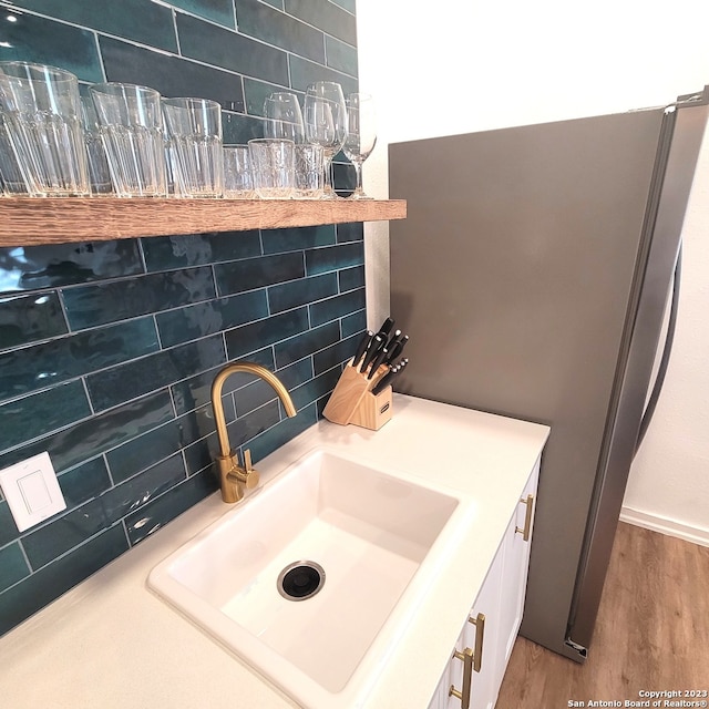 bathroom with vanity and wood-type flooring