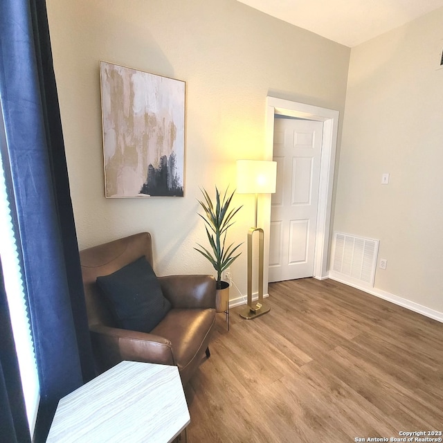 sitting room featuring wood-type flooring