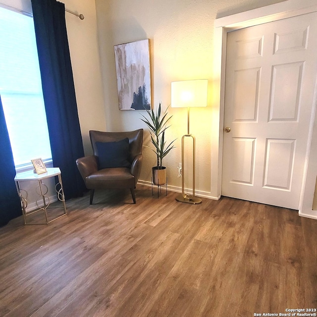 sitting room featuring hardwood / wood-style flooring