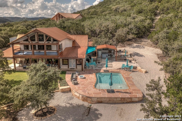 back of house with a patio