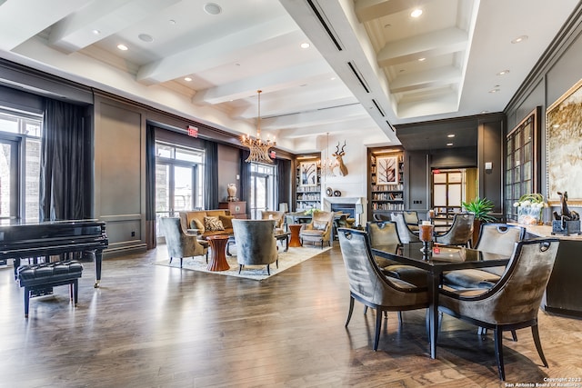 dining room featuring a notable chandelier, coffered ceiling, dark wood-type flooring, and beamed ceiling