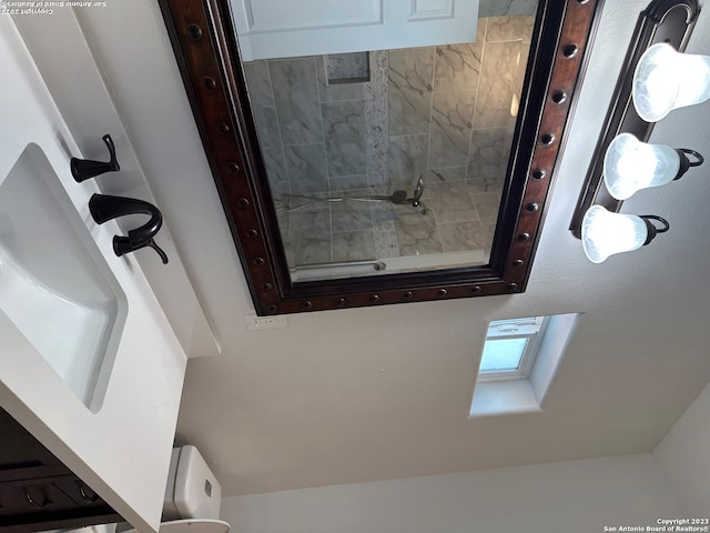 details featuring a skylight and toilet