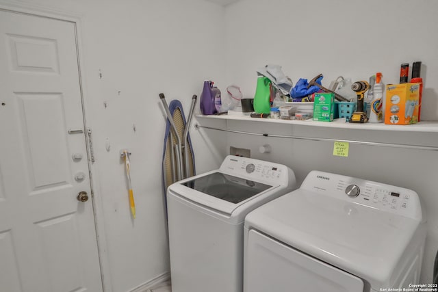 laundry area with washing machine and dryer