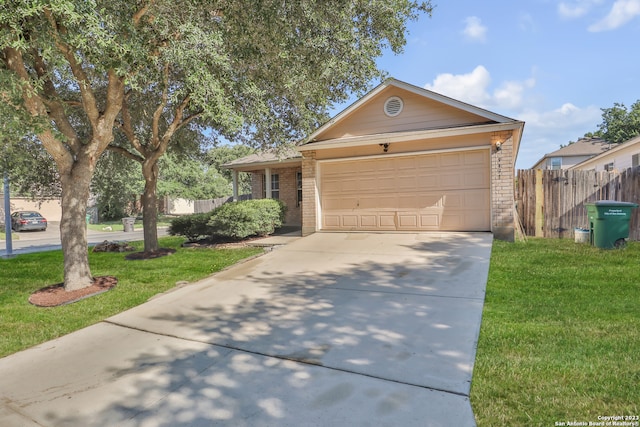 ranch-style home featuring a garage and a front lawn