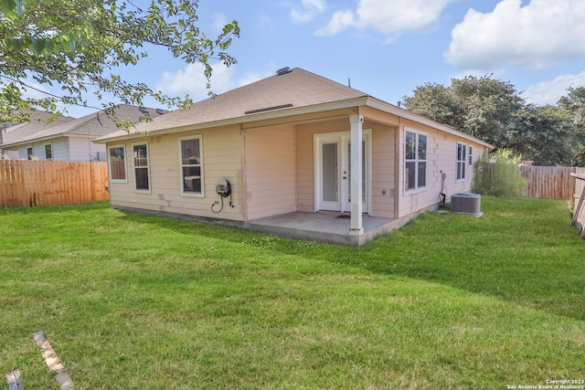 back of house with a yard, a patio, and cooling unit