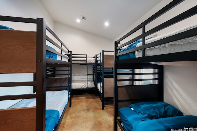 bedroom featuring lofted ceiling