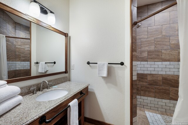 bathroom featuring vanity and a shower with shower curtain