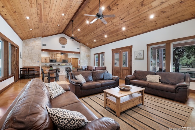 living room with ceiling fan, high vaulted ceiling, light hardwood / wood-style floors, beam ceiling, and wood ceiling