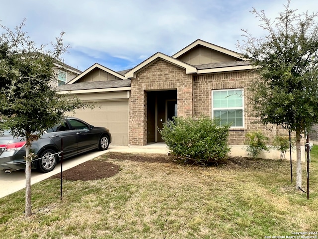 view of front of house with a front lawn and a garage