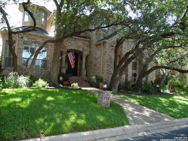 view of front of home with a front yard