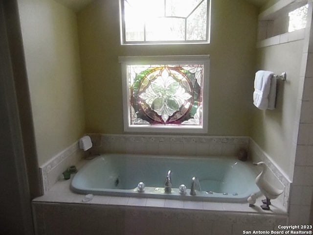 bathroom with tiled bath