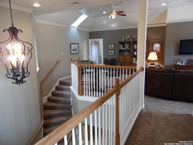 corridor featuring a chandelier, crown molding, dark carpet, and lofted ceiling