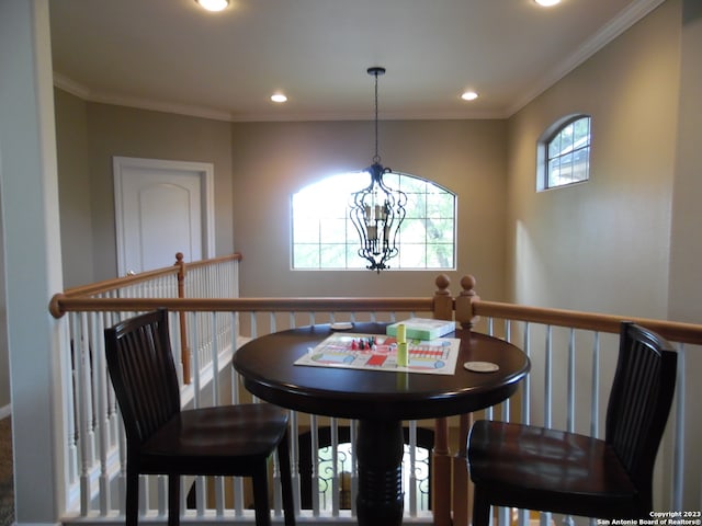 dining room featuring a notable chandelier and ornamental molding