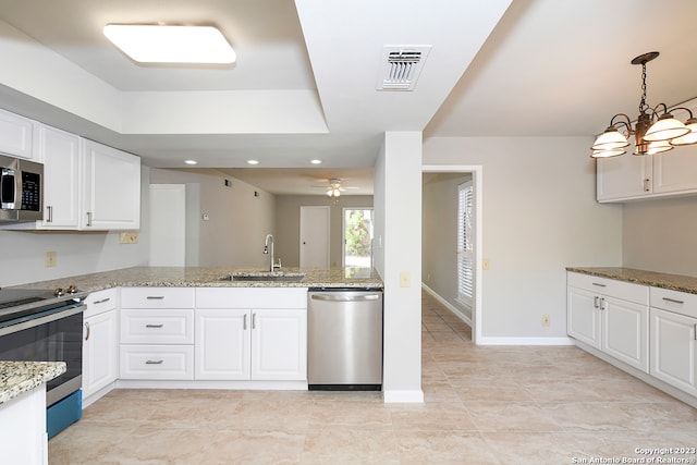 kitchen featuring appliances with stainless steel finishes, light stone counters, light tile floors, sink, and white cabinetry