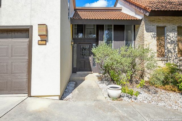 property entrance with a garage