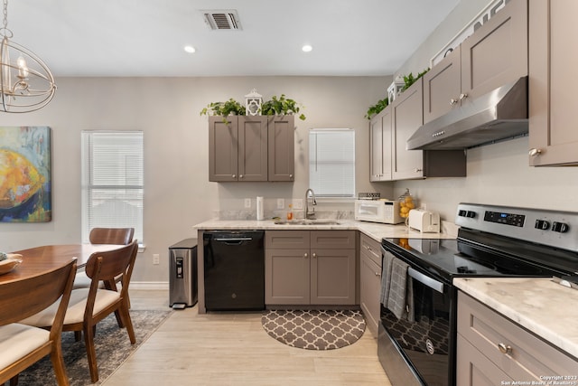 kitchen featuring electric stove, sink, a chandelier, light hardwood / wood-style flooring, and dishwasher