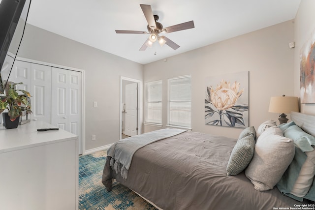 carpeted bedroom with a closet and ceiling fan