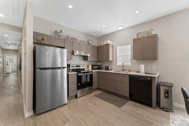 kitchen featuring appliances with stainless steel finishes, gray cabinets, and sink