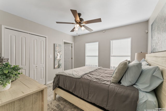 bedroom featuring a closet, dark colored carpet, and ceiling fan