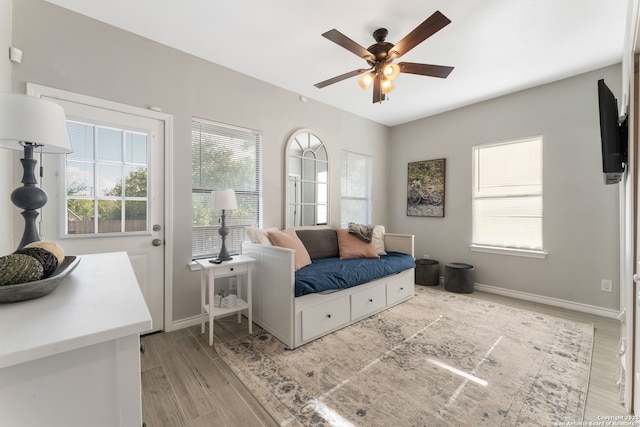 bedroom with ceiling fan and light hardwood / wood-style flooring