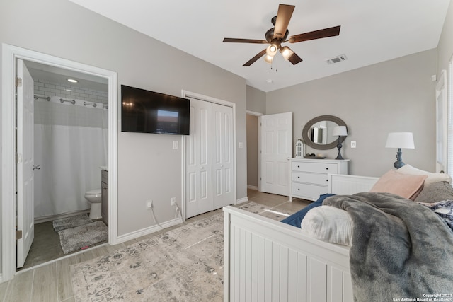 bedroom featuring connected bathroom, ceiling fan, and light hardwood / wood-style flooring