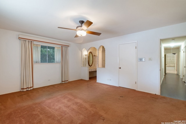 carpeted empty room with ceiling fan