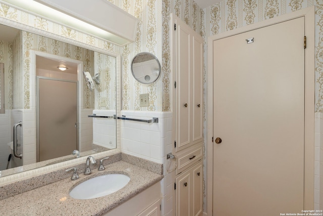 bathroom featuring tile walls and vanity