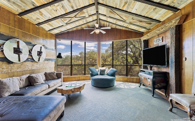 sunroom / solarium with lofted ceiling, ceiling fan, and wooden ceiling