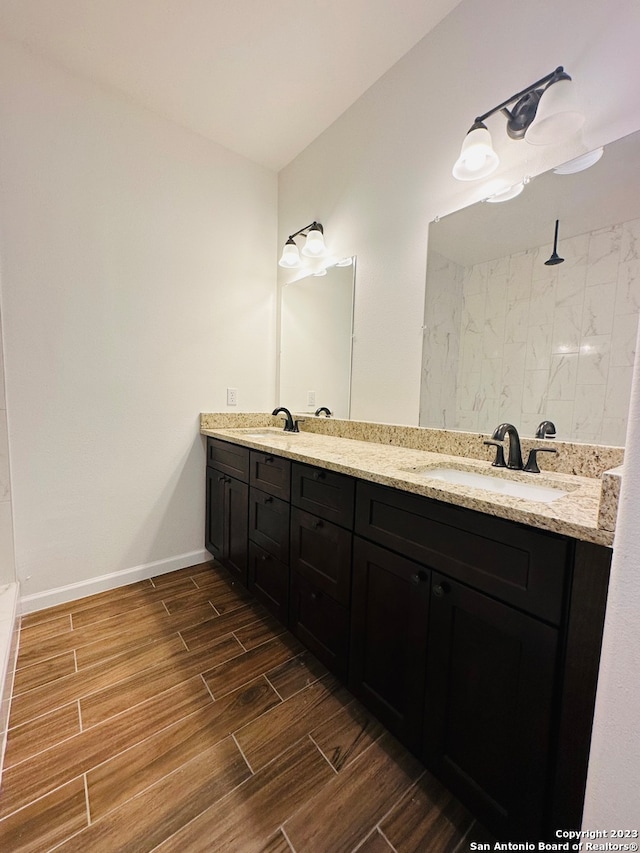 bathroom featuring dual vanity