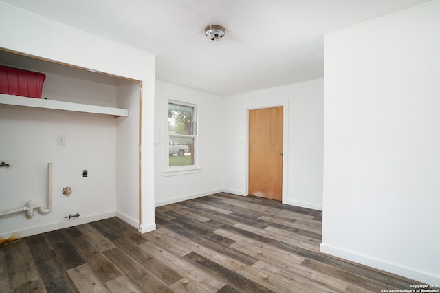 laundry room with hookup for an electric dryer, hookup for a gas dryer, and dark wood-type flooring