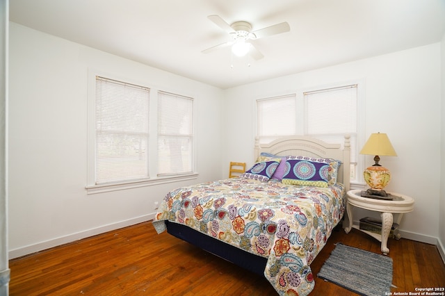 bedroom featuring dark hardwood / wood-style flooring and ceiling fan