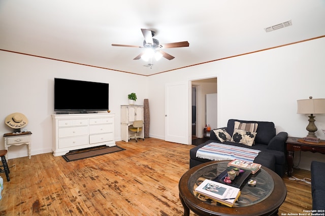 living room featuring light hardwood / wood-style floors and ceiling fan