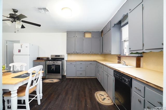 kitchen with gas stove, ceiling fan, white fridge, dark hardwood / wood-style flooring, and dishwasher