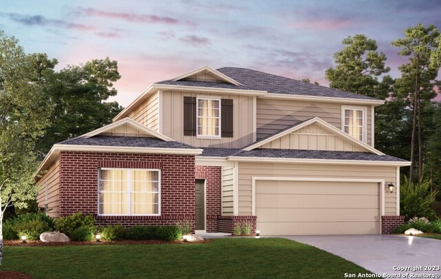 view of front of property with a front lawn, board and batten siding, concrete driveway, a garage, and brick siding