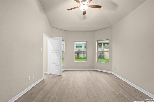 unfurnished room featuring baseboards, wood finished floors, and a ceiling fan