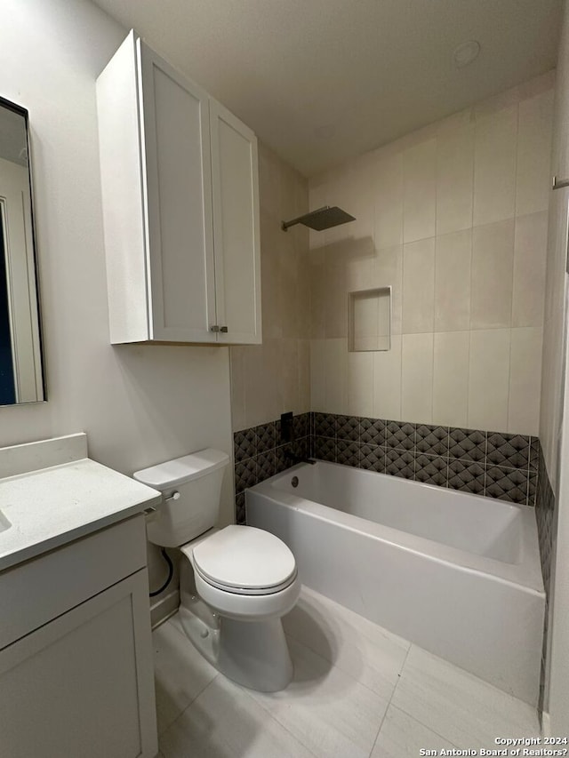 full bathroom with toilet, tile patterned flooring, vanity, and tub / shower combination