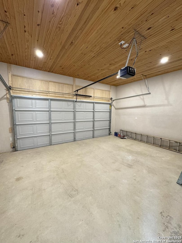 garage with a garage door opener and wooden ceiling