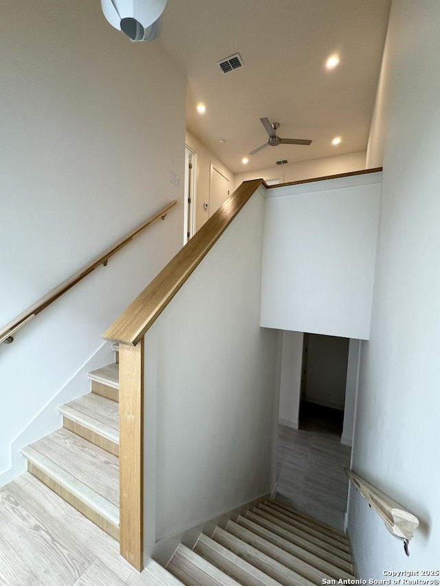 stairway with ceiling fan