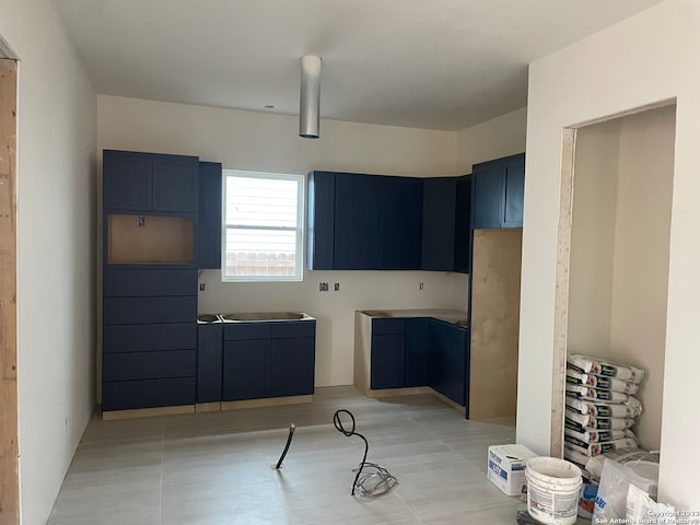 kitchen featuring blue cabinetry