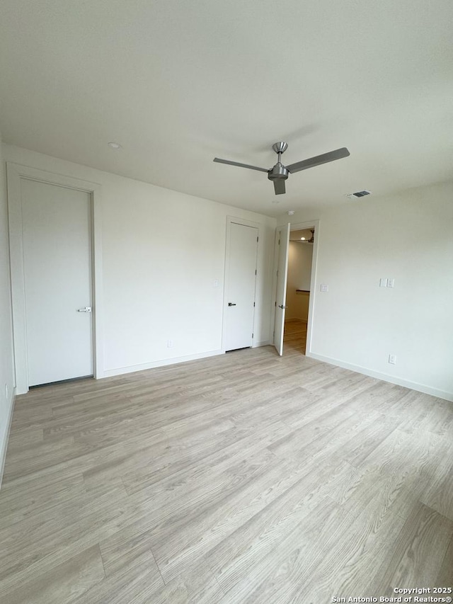 unfurnished bedroom featuring ceiling fan and light hardwood / wood-style floors