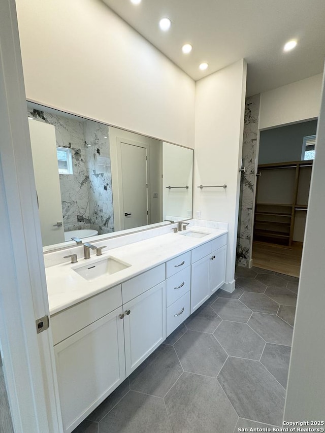 bathroom featuring tile patterned floors and vanity