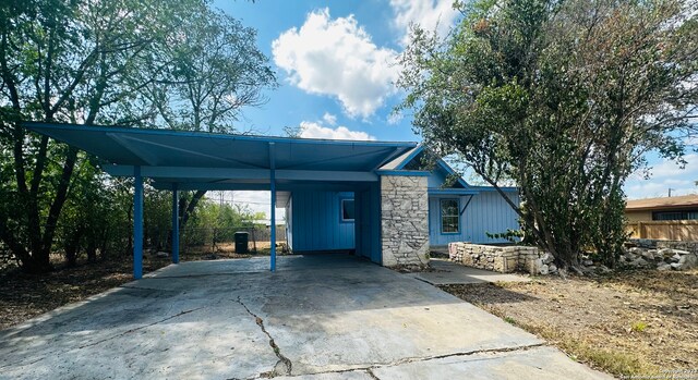 exterior space featuring a carport