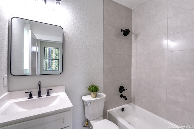 full bathroom with vanity, toilet, and tiled shower / bath combo