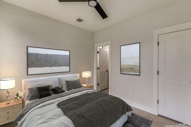 bedroom with ceiling fan and light colored carpet