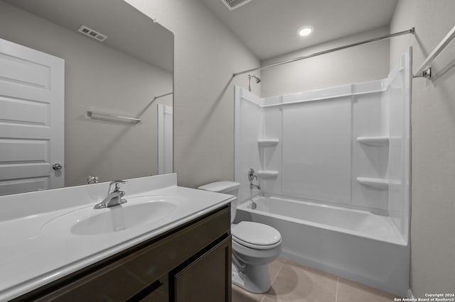 full bathroom with shower / bathing tub combination, tile patterned floors, vanity, and toilet