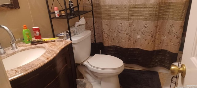 bathroom featuring toilet and vanity