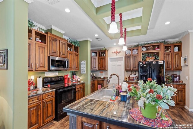 kitchen featuring black appliances, open shelves, a sink, and wood finished floors