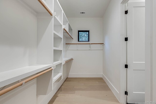 spacious closet with light wood-type flooring