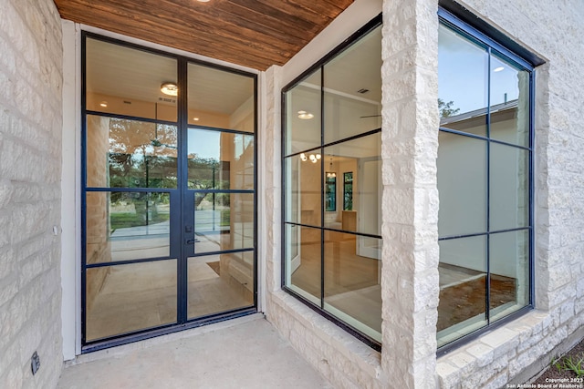 view of exterior entry featuring french doors